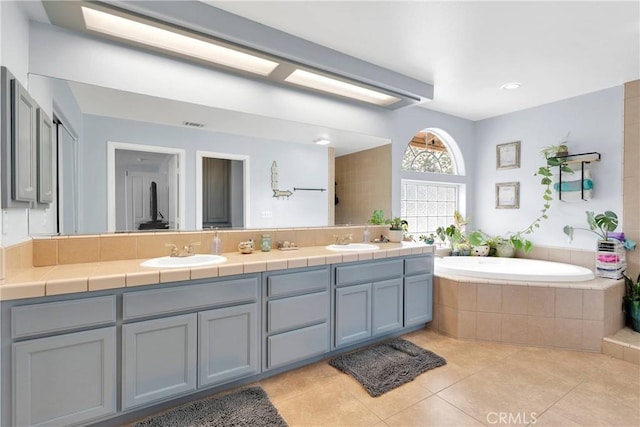 1679 Desert Front Rd, Wrightwood, CA 92397 - full bath featuring double vanity, a garden tub, and tile patterned floors