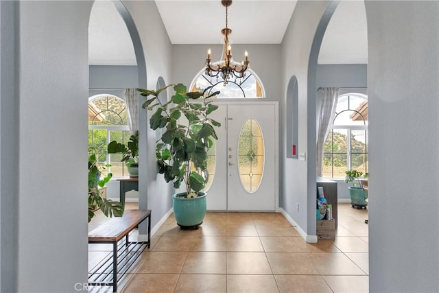 1679 Desert Front Rd, Wrightwood, CA 92397 - tiled foyer featuring arched walkways, a chandelier, and baseboards