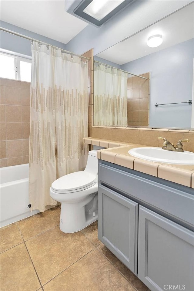1679 Desert Front Rd, Wrightwood, CA 92397 - bathroom with toilet, vanity, tile patterned floors, and shower / tub combo