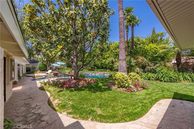 19043 Citronia St, Northridge, CA 91324 - view of grassy yard featuring an outdoor pool and a patio area