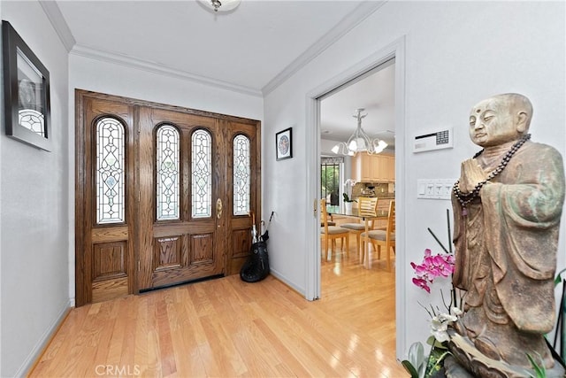 19043 Citronia St, Northridge, CA 91324 - foyer entrance with a chandelier, light wood-type flooring, and crown molding