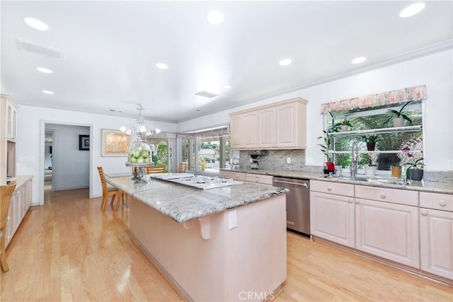 19043 Citronia St, Northridge, CA 91324 - kitchen featuring stainless steel dishwasher, a center island, ornamental molding, white gas cooktop, and a chandelier