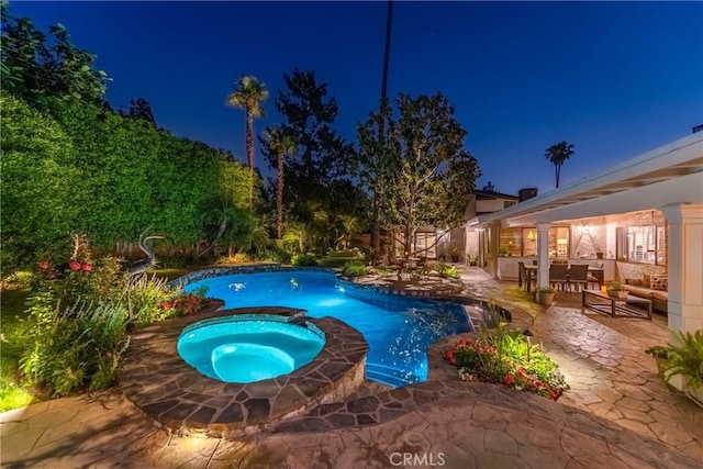 19043 Citronia St, Northridge, CA 91324 - pool at twilight with a patio area, a pool with connected hot tub, and an outdoor living space