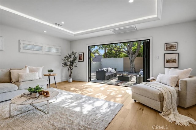 1035 Medford Rd, Pasadena, CA 91107 - living area featuring a tray ceiling, wood finished floors, and recessed lighting