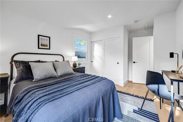 1035 Medford Rd, Pasadena, CA 91107 - bedroom featuring light wood-style flooring, a closet, and attic access