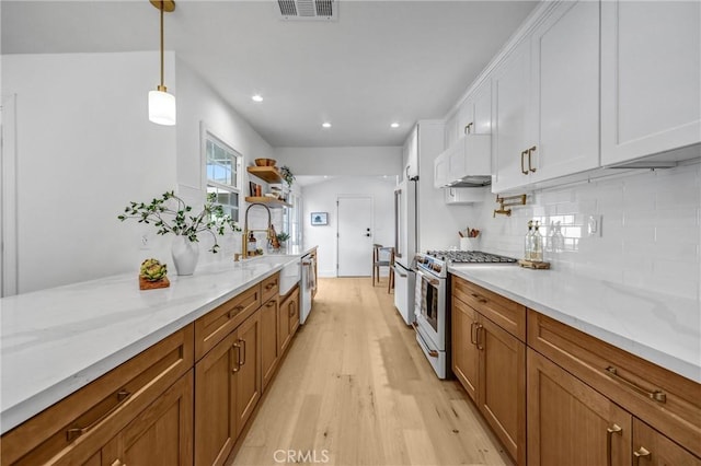 1035 Medford Rd, Pasadena, CA 91107 - kitchen featuring gas range oven, open shelves, dishwasher, light wood-style flooring, and white cabinets