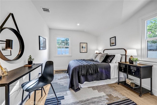1035 Medford Rd, Pasadena, CA 91107 - bedroom with multiple windows, light wood finished floors, and vaulted ceiling