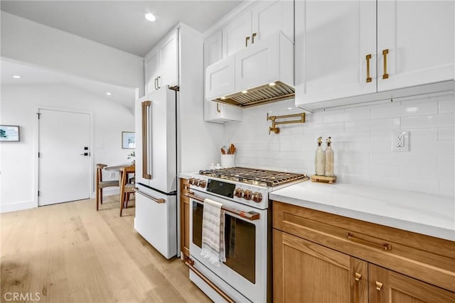1035 Medford Rd, Pasadena, CA 91107 - kitchen featuring premium appliances, decorative backsplash, light wood finished floors, white cabinetry, and recessed lighting