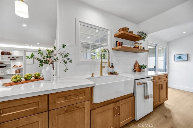 1035 Medford Rd, Pasadena, CA 91107 - kitchen featuring dishwasher, open shelves, light wood-style flooring, decorative backsplash, and light stone counters