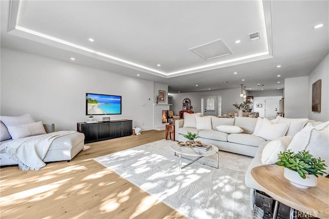 1035 Medford Rd, Pasadena, CA 91107 - living room featuring wood finished floors, a tray ceiling, attic access, and recessed lighting