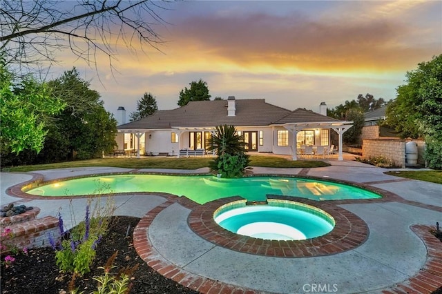 26065 Charing Cross Rd, Valencia, CA 91355 - view of pool featuring a patio, a pool with connected hot tub, and a putting area
