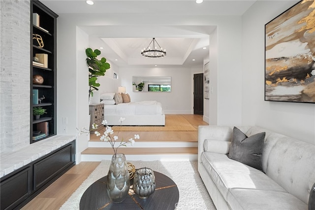 26065 Charing Cross Rd, Valencia, CA 91355 - living area featuring light wood-style flooring, built in shelves, a chandelier, recessed lighting, and baseboards