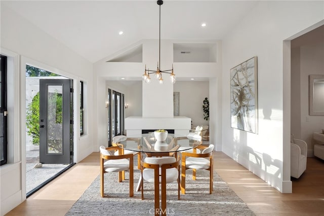26065 Charing Cross Rd, Valencia, CA 91355 - dining area featuring a chandelier, light wood finished floors, recessed lighting, and high vaulted ceiling