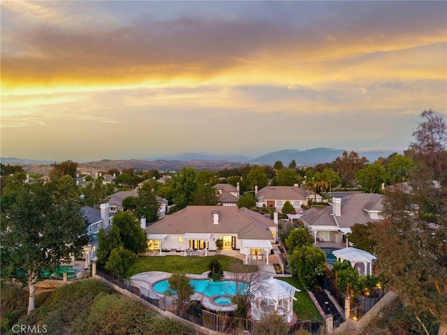 26065 Charing Cross Rd, Valencia, CA 91355 - aerial view at dusk of view of pool, a mountain view, and a residential view