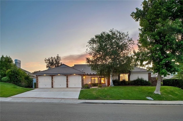26065 Charing Cross Rd, Valencia, CA 91355 - single story home featuring an attached garage, a front yard, concrete driveway, and stucco siding