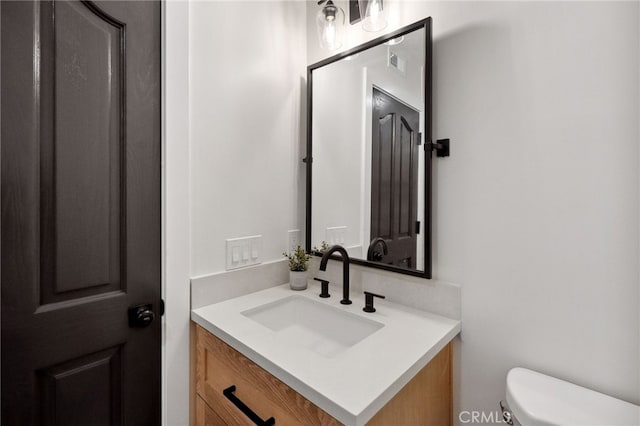 26065 Charing Cross Rd, Valencia, CA 91355 - bathroom featuring vanity and toilet
