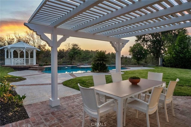 26065 Charing Cross Rd, Valencia, CA 91355 - patio terrace at dusk featuring a gazebo, a yard, an outdoor pool, and a patio area