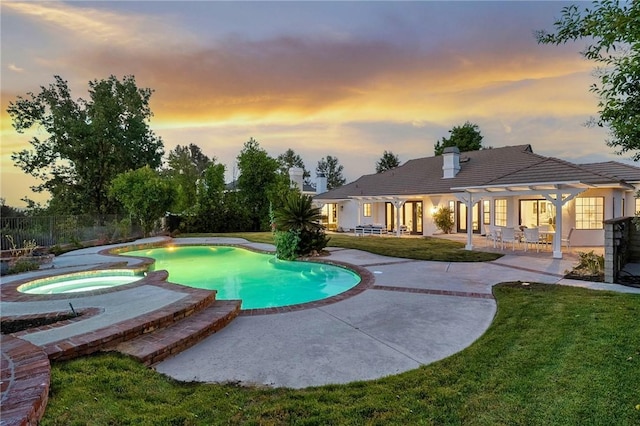 26065 Charing Cross Rd, Valencia, CA 91355 - pool at dusk with a patio, a pergola, and a pool with connected hot tub