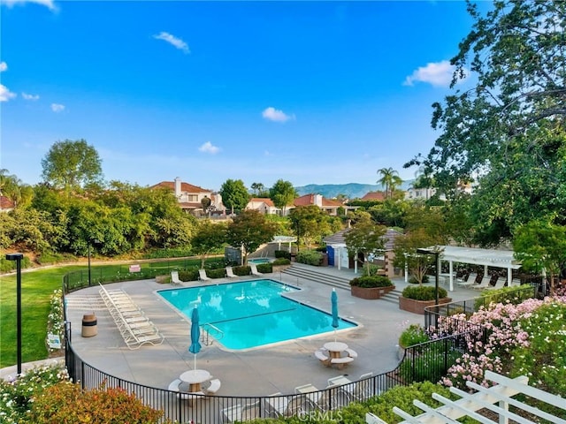 26065 Charing Cross Rd, Valencia, CA 91355 - community pool with a pergola and a patio