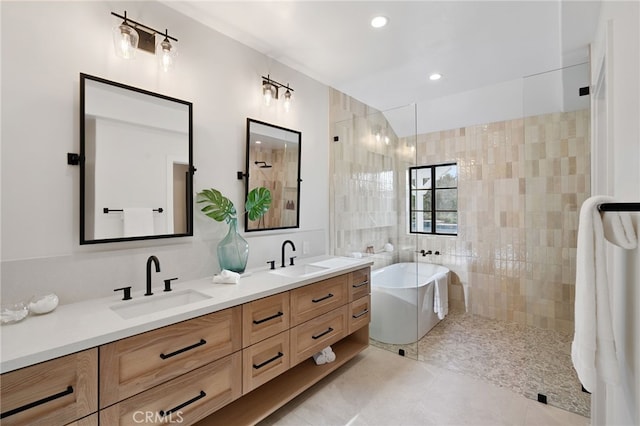 26065 Charing Cross Rd, Valencia, CA 91355 - full bathroom with a soaking tub, double vanity, a walk in shower, tile patterned floors, and recessed lighting