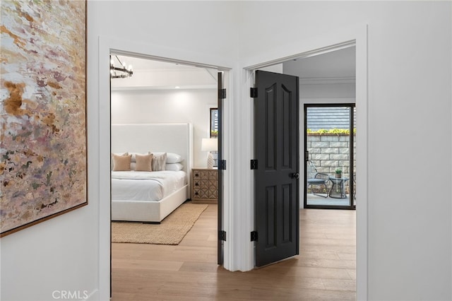 26065 Charing Cross Rd, Valencia, CA 91355 - bedroom featuring wood finished floors, crown molding, and a chandelier