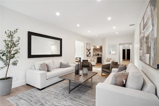 26065 Charing Cross Rd, Valencia, CA 91355 - living area with wood finished floors, recessed lighting, baseboards, and beverage cooler