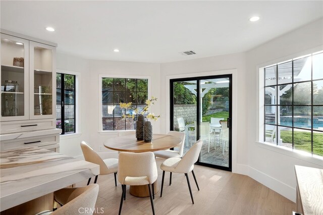 26065 Charing Cross Rd, Valencia, CA 91355 - dining room with healthy amount of natural light, recessed lighting, light wood-style floors, and baseboards