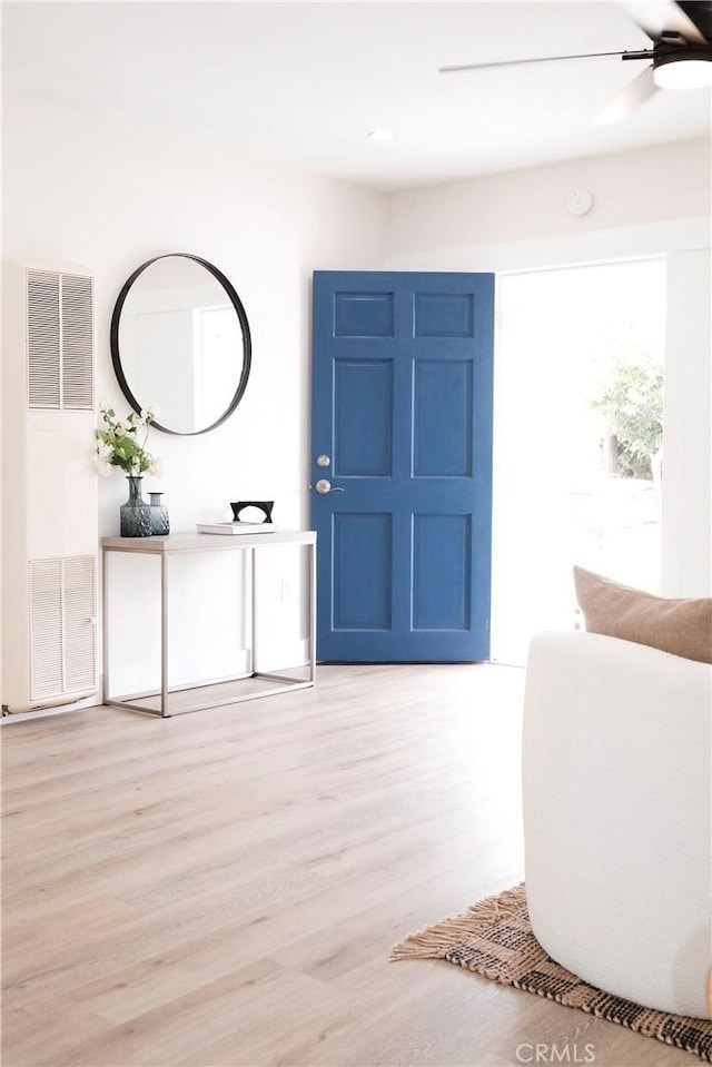 3222 E 10th St, Long Beach, CA 90804 - entryway with light wood finished floors, a ceiling fan, and a heating unit