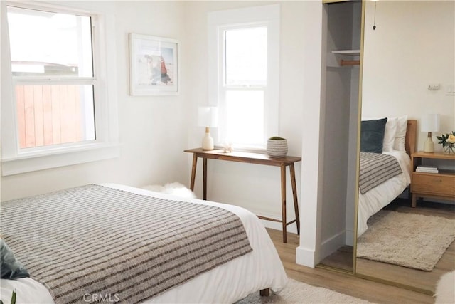 3222 E 10th St, Long Beach, CA 90804 - bedroom featuring wood finished floors and a closet