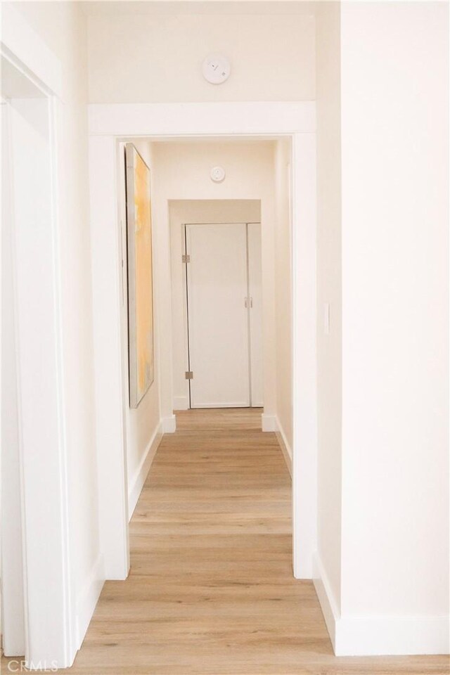 3222 E 10th St, Long Beach, CA 90804 - hall featuring light wood-style floors and baseboards