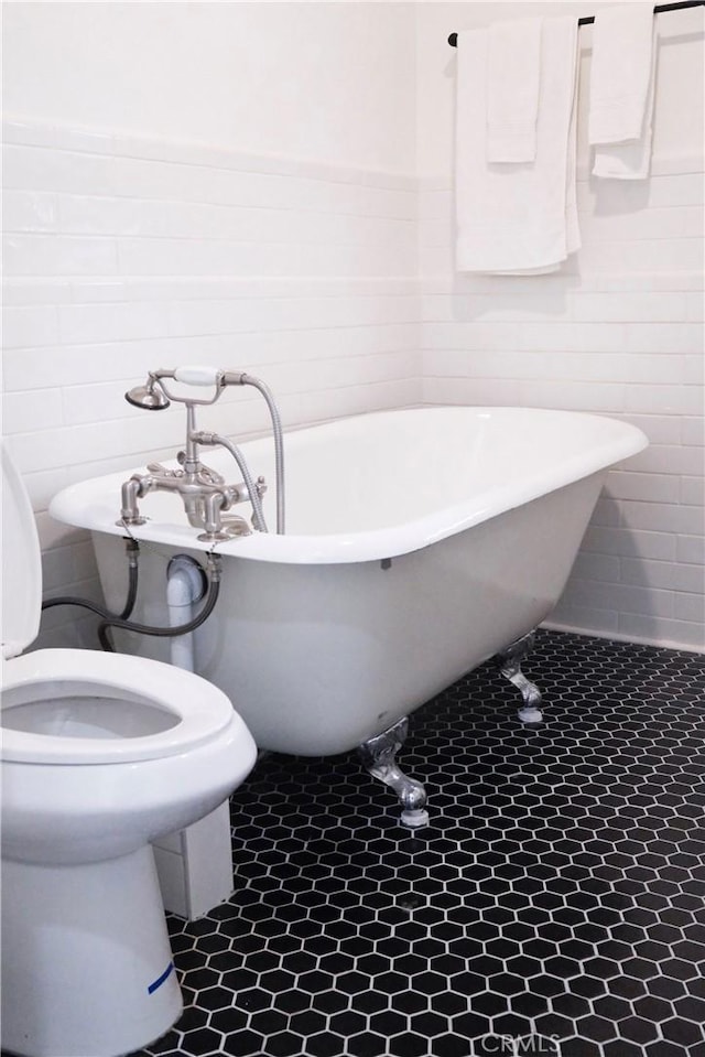 3222 E 10th St, Long Beach, CA 90804 - bathroom featuring a soaking tub and tile walls