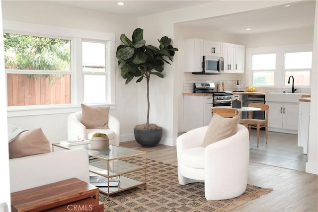 3222 E 10th St, Long Beach, CA 90804 - living room featuring recessed lighting and light wood-style floors