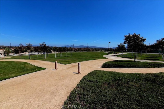 24207 Via Perla, Valencia, CA 91354 - surrounding community with a mountain view and a lawn