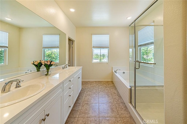 24207 Via Perla, Valencia, CA 91354 - full bath featuring plenty of natural light, a bath, double vanity, and recessed lighting