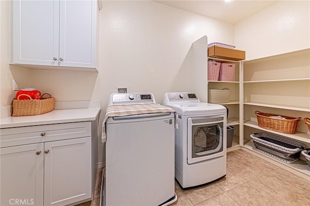 24207 Via Perla, Valencia, CA 91354 - washroom with washing machine and clothes dryer, cabinet space, and light tile patterned floors