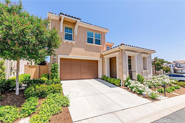 24207 Via Perla, Valencia, CA 91354 - view of front facade featuring stucco siding, a tile roof, an attached garage, and concrete driveway
