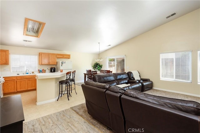 11017 Tipperary Dr, Bakersfield, CA 93311 - living area featuring lofted ceiling and baseboards