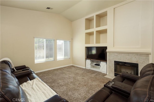 11017 Tipperary Dr, Bakersfield, CA 93311 - living area with baseboards, built in features, carpet flooring, lofted ceiling, and a tiled fireplace