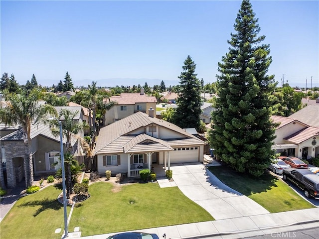 11017 Tipperary Dr, Bakersfield, CA 93311 - view of front of property featuring a residential view, driveway, a garage, a front yard, and a tiled roof