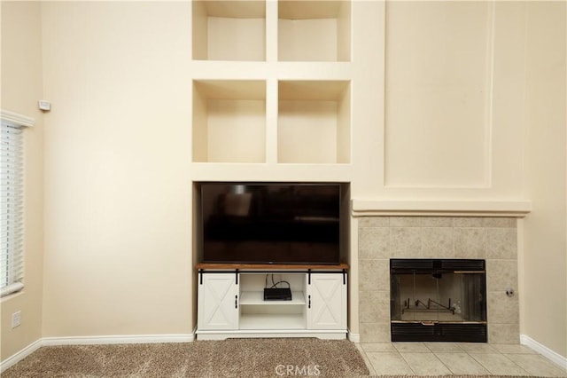 11017 Tipperary Dr, Bakersfield, CA 93311 - detailed view of built in shelves, baseboards, and a tile fireplace