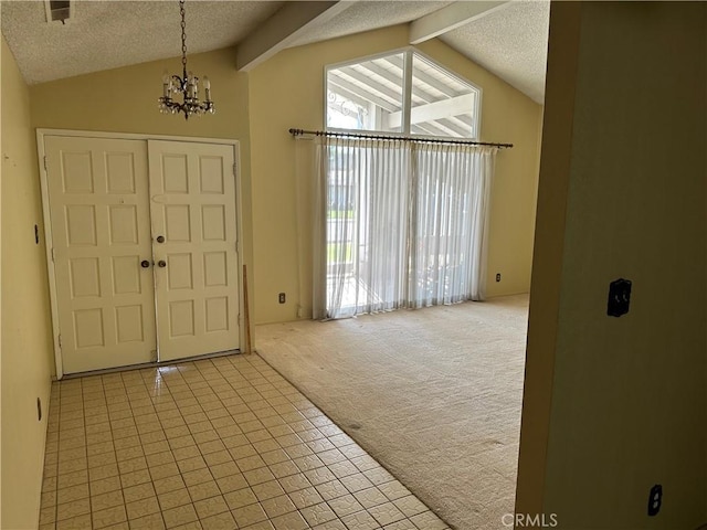 2915 El Camino Real, Merced, CA 95340 - tiled entrance foyer featuring carpet floors, a textured ceiling, and a chandelier
