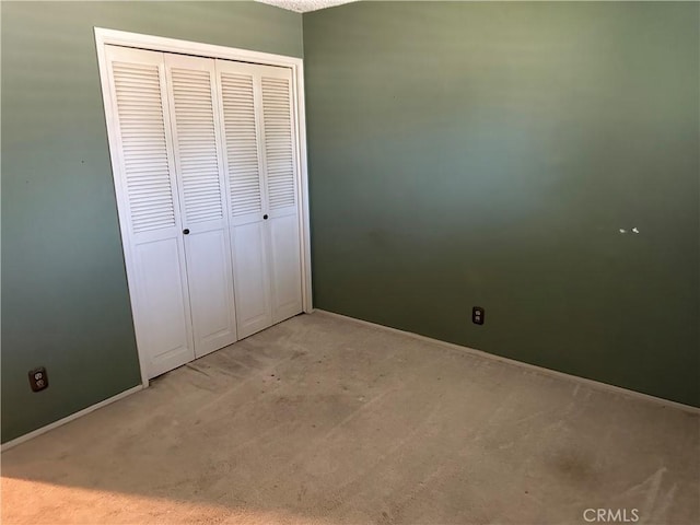 2915 El Camino Real, Merced, CA 95340 - unfurnished bedroom featuring light colored carpet, baseboards, and a closet