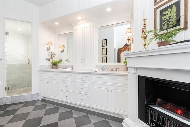 105 Via Waziers, Newport Beach, CA 92663 - bathroom with double vanity, a shower stall, and tile patterned flooring