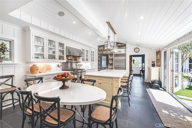 105 Via Waziers, Newport Beach, CA 92663 - dining area with plenty of natural light, wood ceiling, and recessed lighting