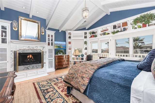 105 Via Waziers, Newport Beach, CA 92663 - bedroom featuring a fireplace, wooden ceiling, and wood finished floors