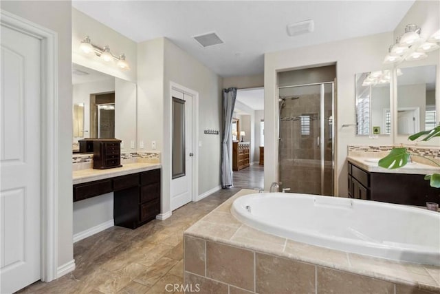 45976 Camino Rubi, Temecula, CA 92592 - bathroom featuring a shower stall, a garden tub, two vanities, and baseboards