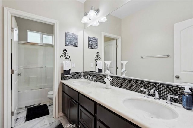 45976 Camino Rubi, Temecula, CA 92592 - full bath with toilet, double vanity, bath / shower combo with glass door, and decorative backsplash