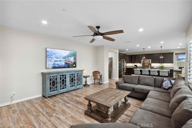 45976 Camino Rubi, Temecula, CA 92592 - living room with baseboards, ceiling fan, recessed lighting, and light wood finished floors