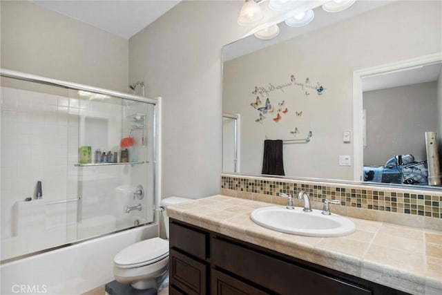 45976 Camino Rubi, Temecula, CA 92592 - ensuite bathroom featuring vanity, combined bath / shower with glass door, toilet, and backsplash