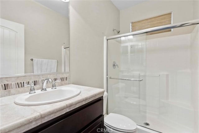45976 Camino Rubi, Temecula, CA 92592 - bathroom featuring a stall shower, toilet, and vanity